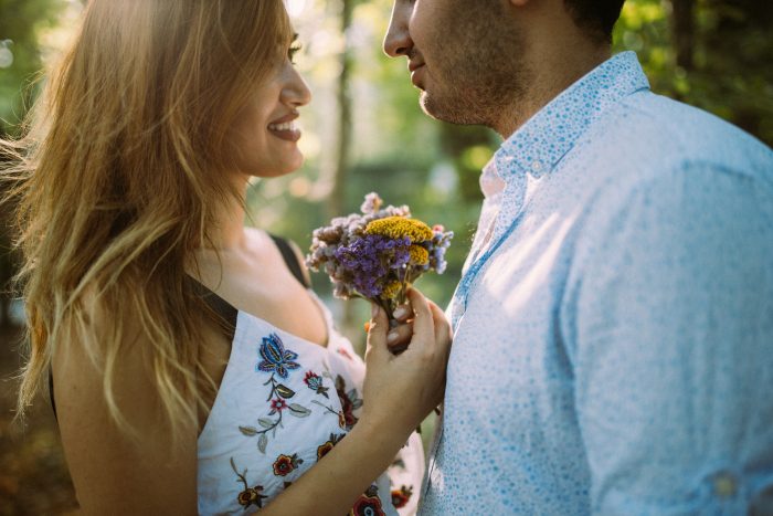 Awoman giving her husband fower